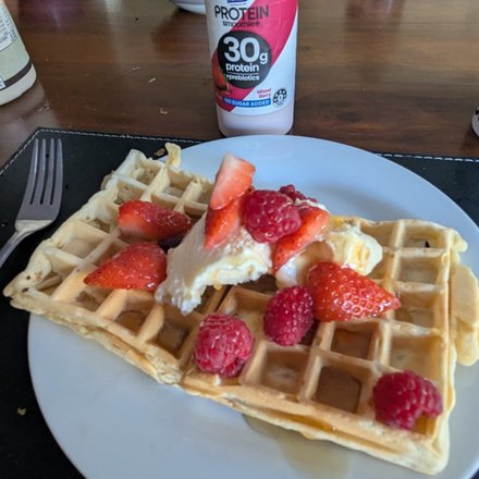 Waffle with strawberries and cream